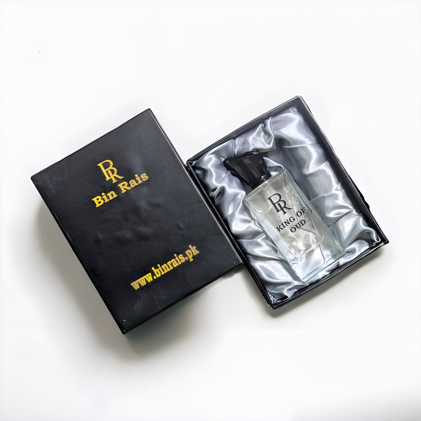 A signature King of Oud perfume blend with smooth white oud, photographed on a dark background for a powerful, majestic feel.